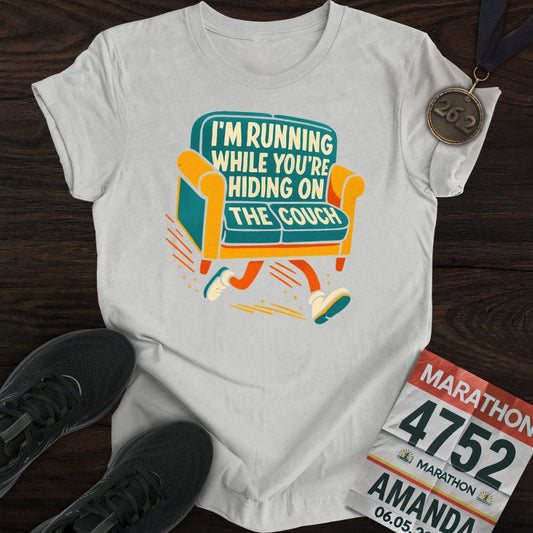 Printify T-Shirt Sport Grey / S I’m Running While You’re Hiding on the Couch T-shirt